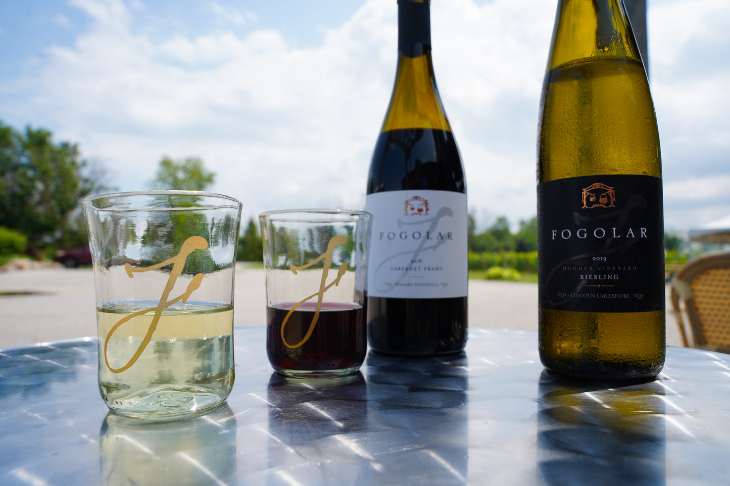 Fogolar Wines Bicchierri on a bistro table with red and white wine
